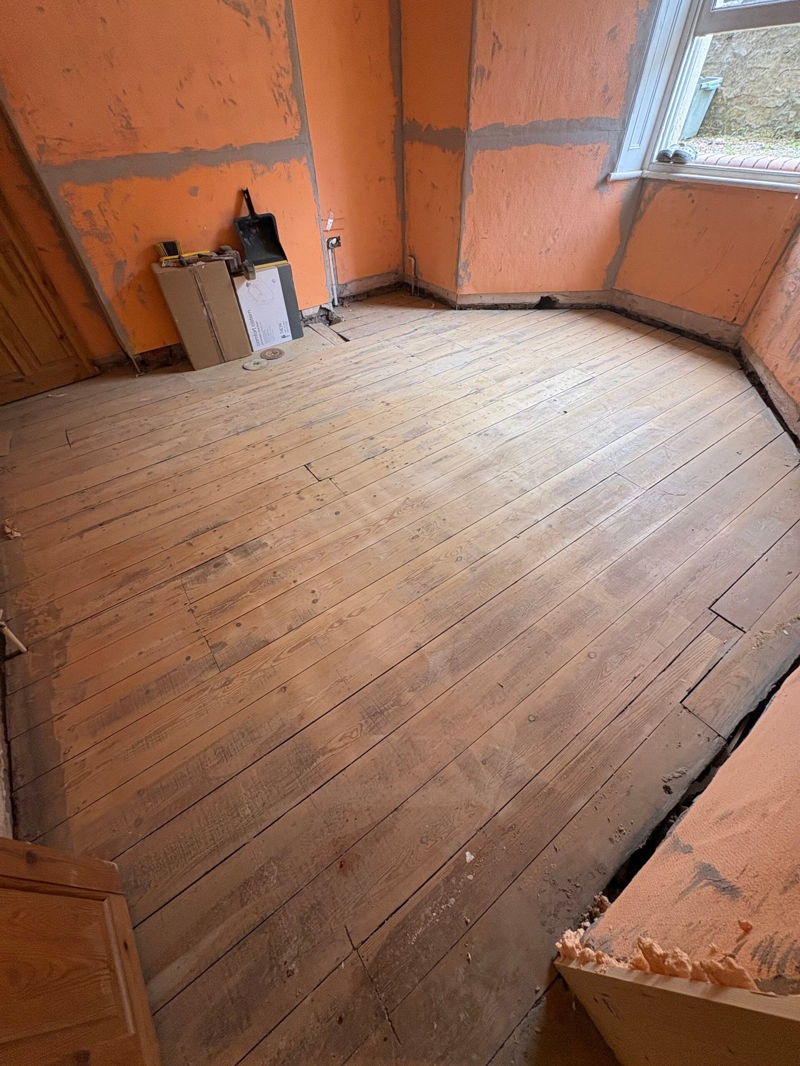 ISOTHERM wall lining around a bay window above sanded timber floorboards in Redland