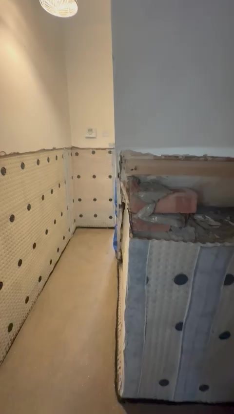 A further view of the membrane installation and floor before plastering.